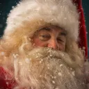 A person dressed up as Santa Claus