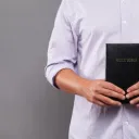 A man holding a Bible.