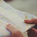Hands holding a map.