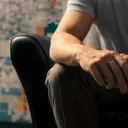 Man sitting in leather chair.