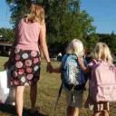 mom and daughters going to school