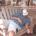 man sleeping on a bench