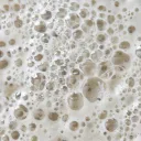 Bubbles on the top of liquid.