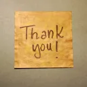 Thank you! written on brown paper.