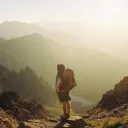 A person a top of a mountain peak.