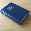 A Bible on a table.