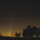 People sitting outside looking up at the stars.