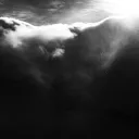 Dark clouds with sunlight filtering through.