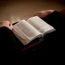 A person reading a Bible.
