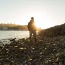 Sunset behind a person.