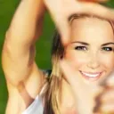 Girl smiling with fingers making a frame - Who Is the Center of Our Worship?