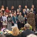 a choir performing on a stage