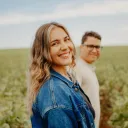 a woman and a man in a field