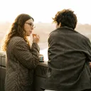 A man and woman talking. 