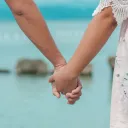 a man and a woman holding hands