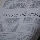 Bible opened to the book of Acts.