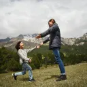 a child running to a woman with outstretched arms