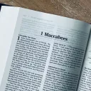 Bible open on a table to 1 Maccabees