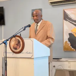 a man standing at a lectern