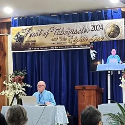 2024 Feast of Tabernacles Baguio City, Philippines a man sitting at a table to give a presentation