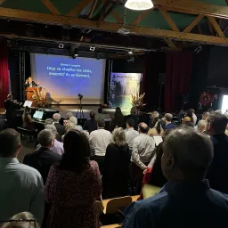 2024 Feast of Tabernacles Club Miléade La Gaillarde, France people standing to sing hymns in church