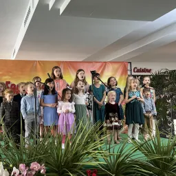a children's choir on stage