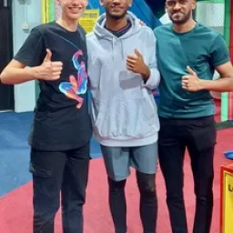 2024 Feast of Tabernacles Penang, Malaysia three men standing with thumbs up in front of a playground