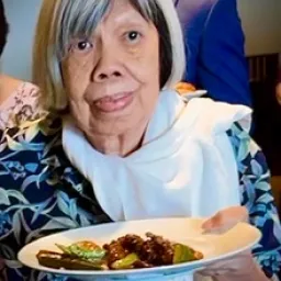 2024 Feast of Tabernacles Penang, Malaysia an older woman holding a plate of food