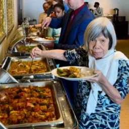 2024 Feast of Tabernacles Penang, Malaysia people standing in line and putting food on their plates