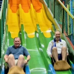 2024 Feast of Tabernacles Penang, Malaysia two men sliding down a colorful slide