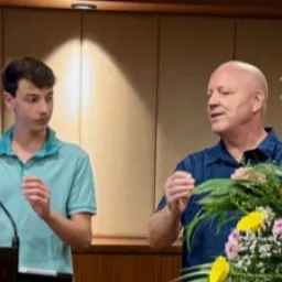 2024 Feast of Tabernacles Penang, Malaysia a man teaching a younger man to lead songs