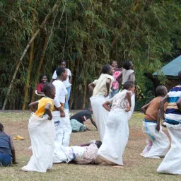 people completing a sack race