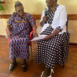 two women seated indoors