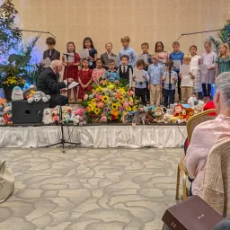 children singing on a stage