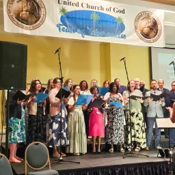 a choir performing on a stage