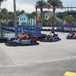 people riding go karts
