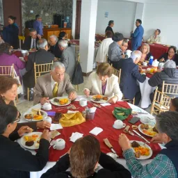 people seated indoors at dining tables