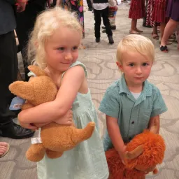 two children with plush animals