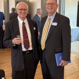 two men wearing suits