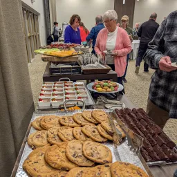 a table filled with food, including a cookie platter