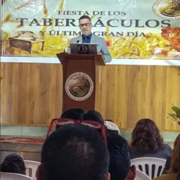 a man standing at a lectern
