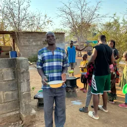 a man holding a casserole dish