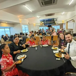a group of people seated around a table