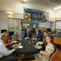 a group of people seated around a table