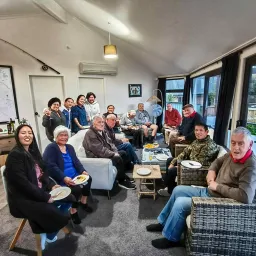 a group of people seated indoors