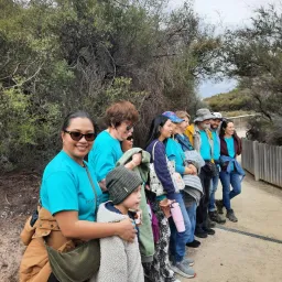 a line of people standing outside