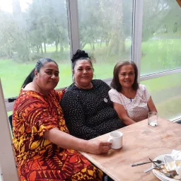 three women seated at a table