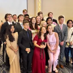 a group of people wearing formal wear