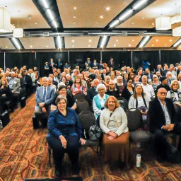 a group of people seated indoors