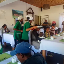 a group of people preparing a meal